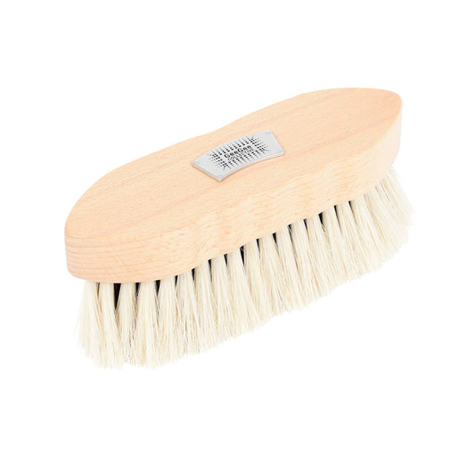 A horse grooming brush with natural bristles and a wooden handle.