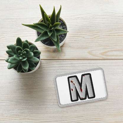 Official SMT “M” Logo Embroidered Patch